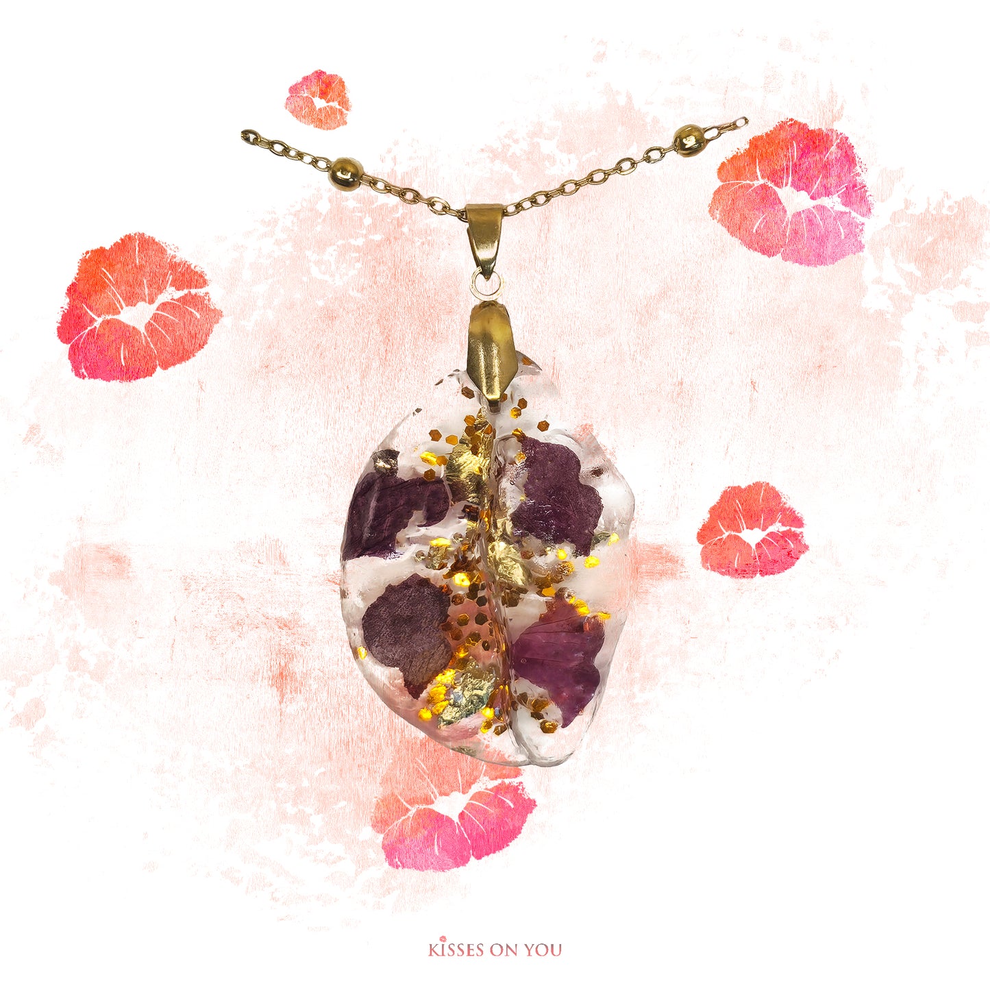 rose petal kisses set in resin big kiss pendant with gold leaf and sparkles with 14K gold plated chain