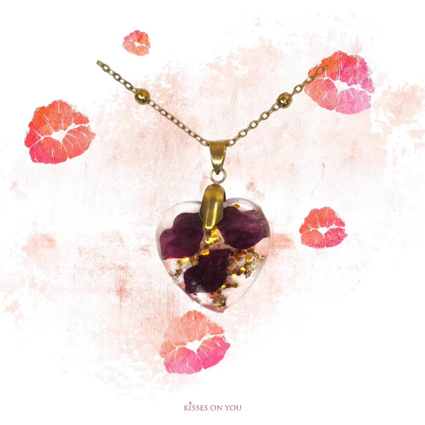 rose petal kisses set in resin heart pendant with gold leaf and sparkles with 14K gold chain